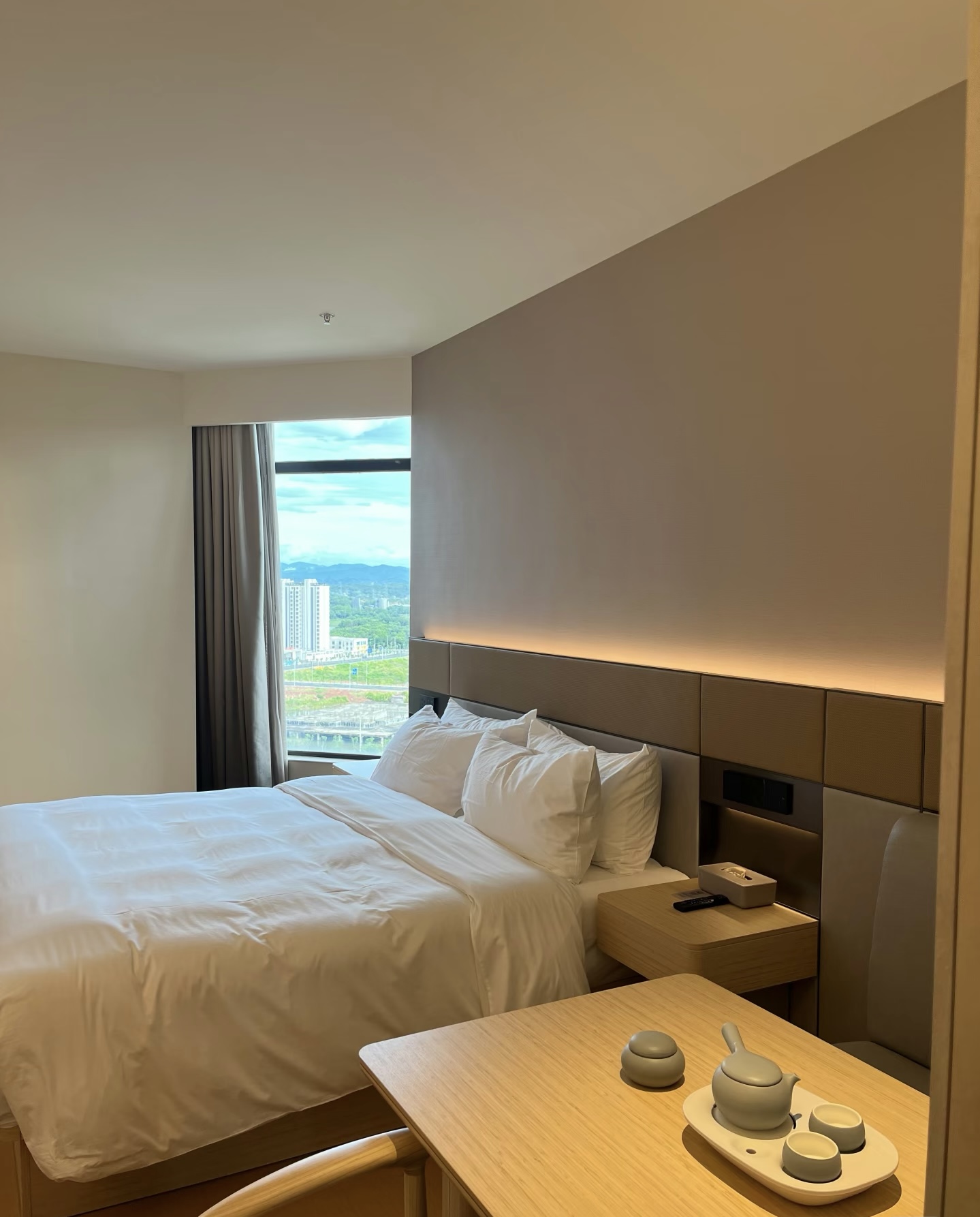 Luxury hotel guest room with white bedding
